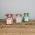 scented candle in jar with metal clip
