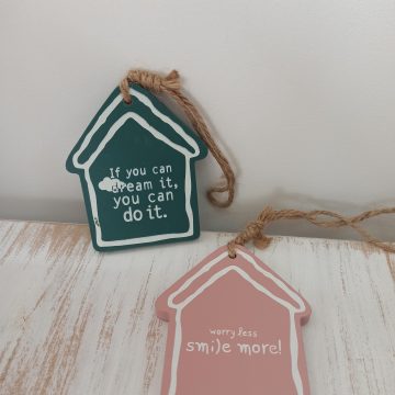 hanging wooden house with quote